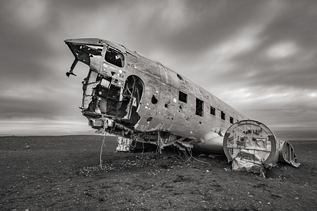 ic:Abandoned Photography Artist captures a hauntingly isolated old plane crash on Iceland's Sólheimasandur Beach, embodying desolation and forgotten history.