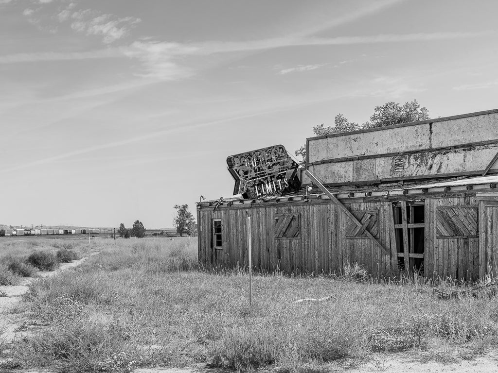 ic:Abandoned Photography Artist's portrayal of the Outer Limits Restaurant on Route 66 in Sidney, Nebraska, a symbol of forgotten American road trip culture.