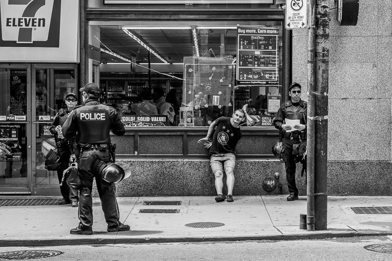 Police arrest a protestor in Toronto