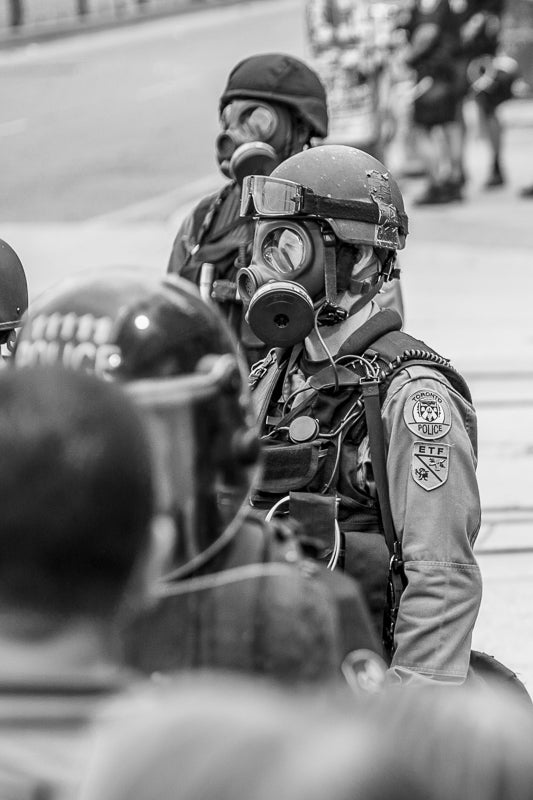 Riot police wearing gas mask