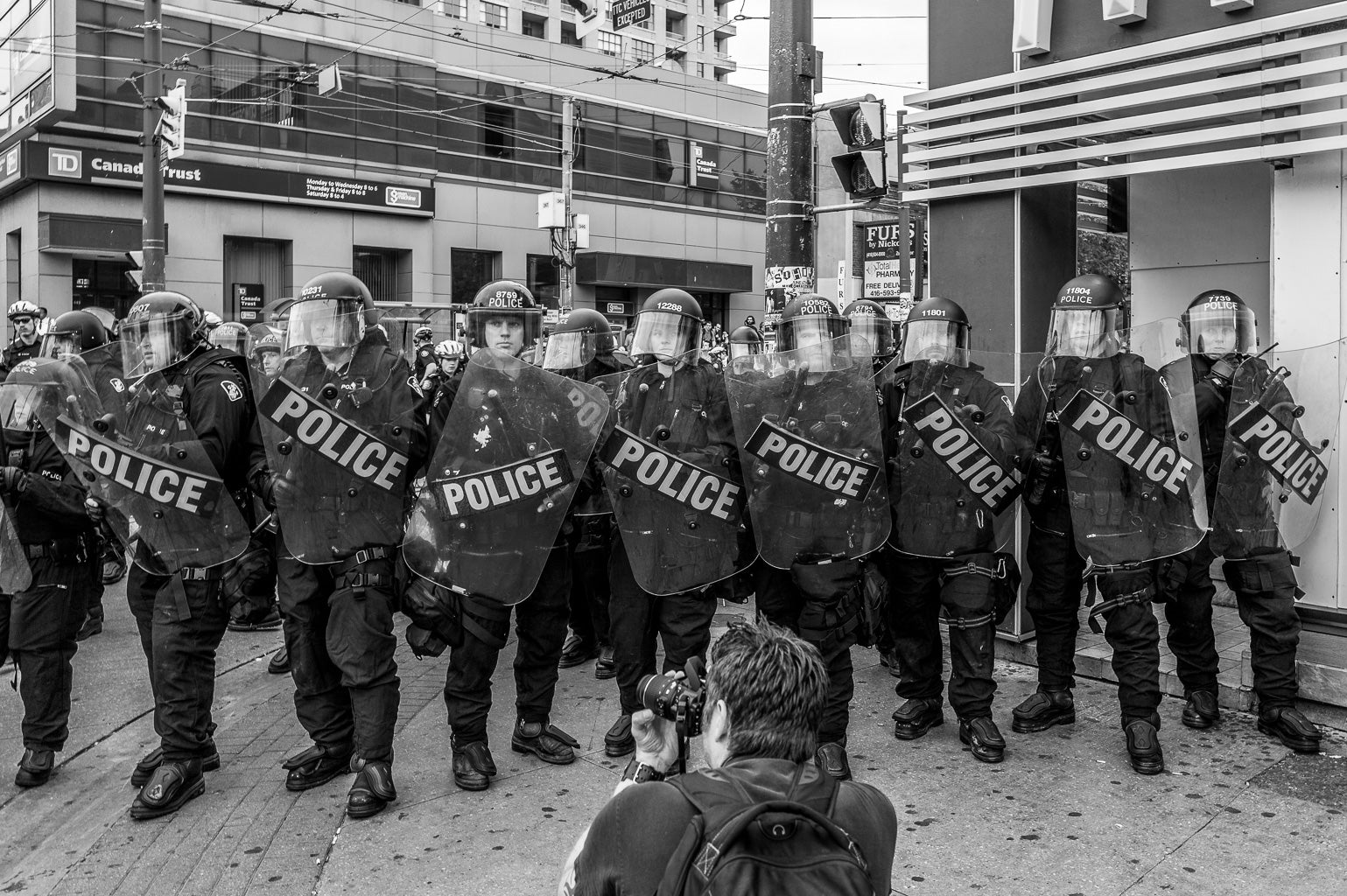 ic:Police in riot gear being photographed at G20 Summit