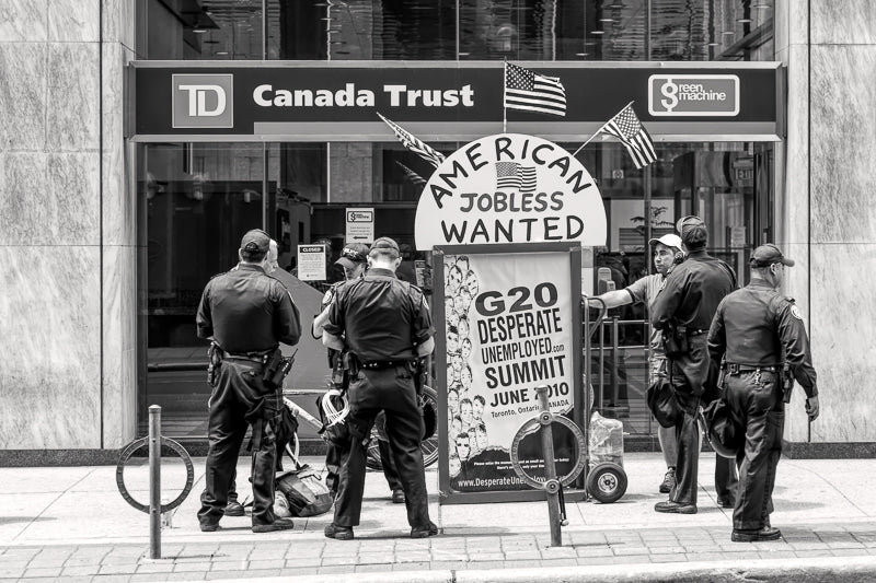 Police talking to protestor 2010 G7 Summit Toronto Canada