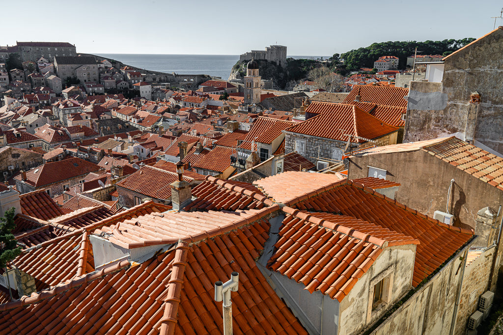 ic:Breathtaking panoramic view of Dubrovnik showcasing the vibrant Croatia roof tiles against the Adriatic Sea.