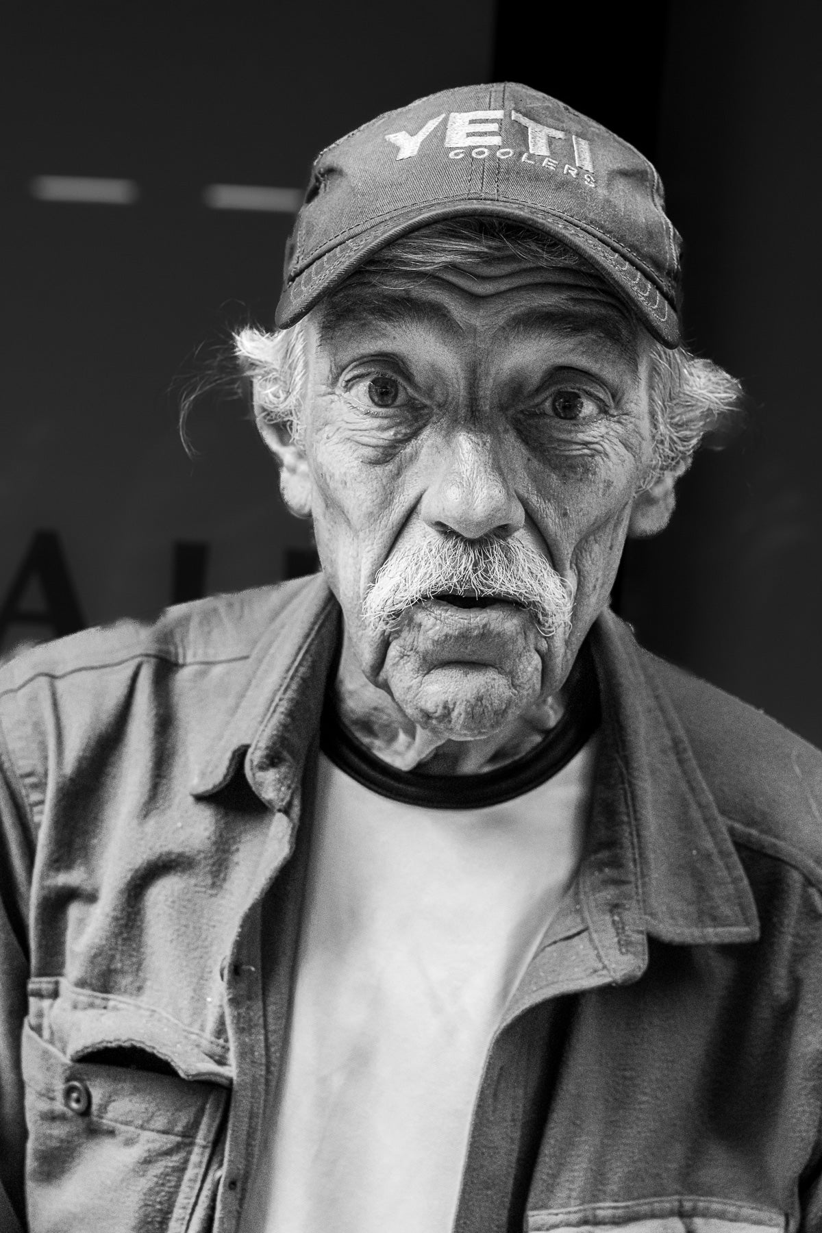ic:In this photo of a surprised look photo of an older man in New York, I spent 15 minutes talking to him and taking various street portraits with consent.