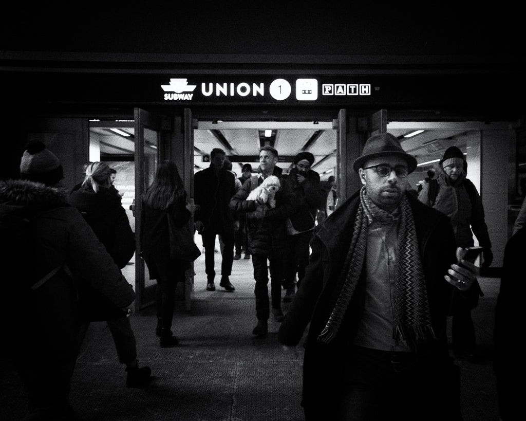 ic:Young man with a dog leaving the train station in Toronto's Downtown Core