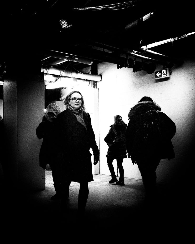 ic:Dark passage in Toronto’s Union Station as people journey oblivious of other passengers