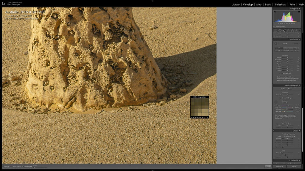 Select the eyedropper tool in the lens correction manual pallet and click on the fringes color
