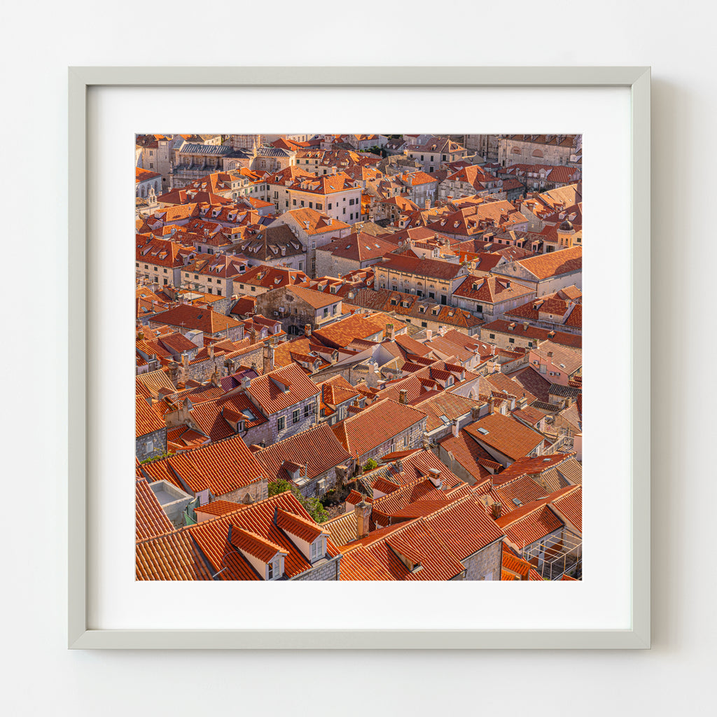 ic:Historic Dubrovnik city walls overlooking the iconic red and orange Croatia roof tiles, symbolizing the city's rich heritage.