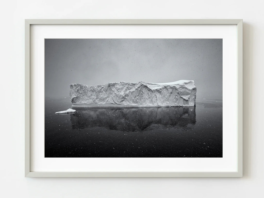 ic:Majestic Iceberg Amid Antarctic Snowstorm Dramatic Photo | Dan Kosmayer Photo Art Print