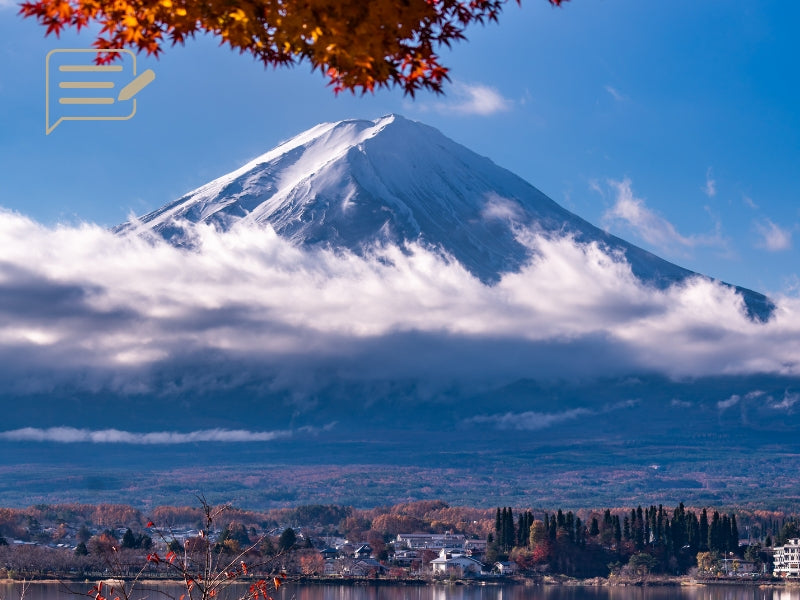 ic:Majestic Mount Fuji with autumn foliage and clear skies, a must-see for fall travelers in Japan.