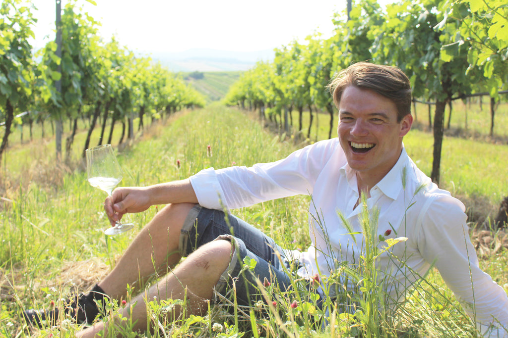 Winemaker in vineyard