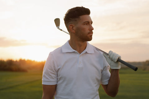 Golfer wearing white polo shirt
