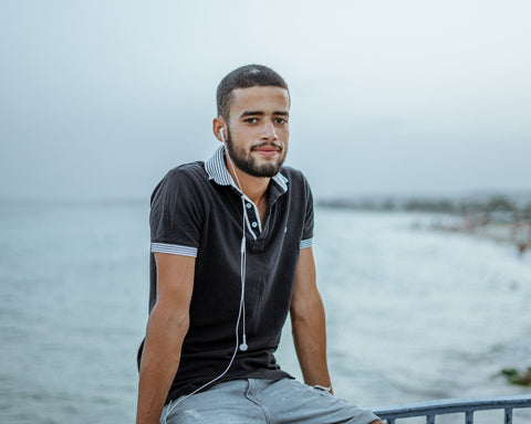 Man with contrast collar at beach