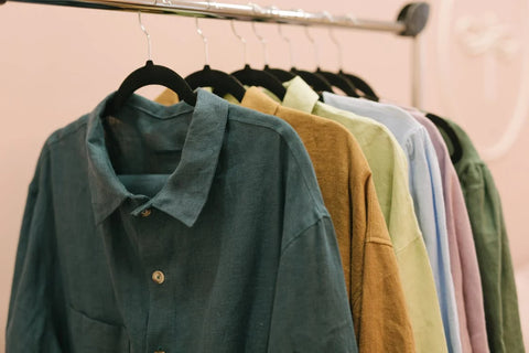 Button down shirts hanging on a rack