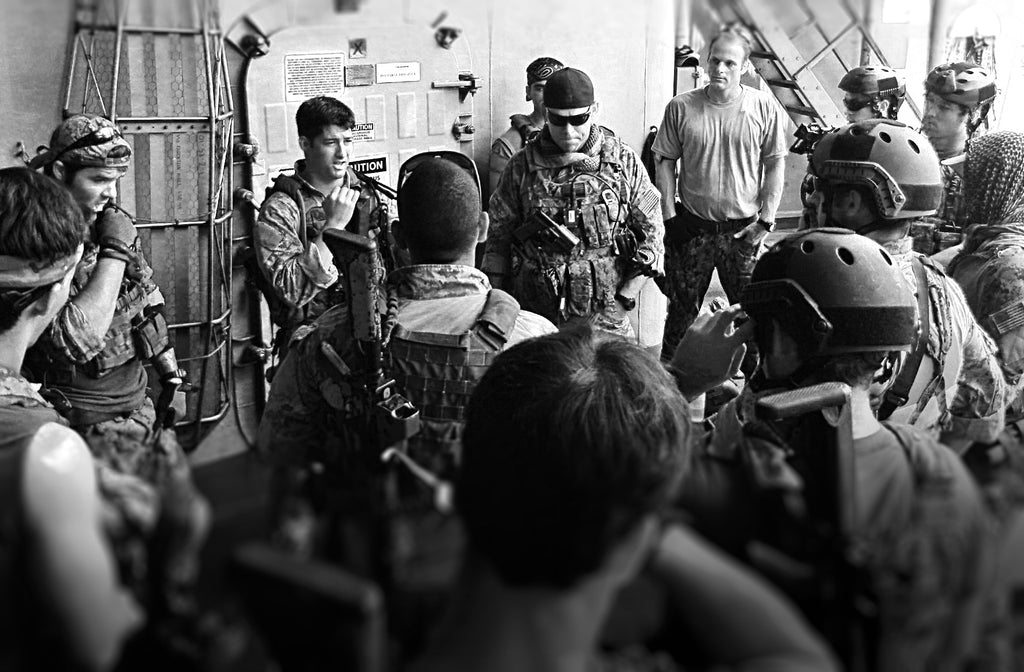 SWCC and SEAL pre-mission brief. Somewhere in the Gulf of Oman. That's me with the black, backwards ballcap.
