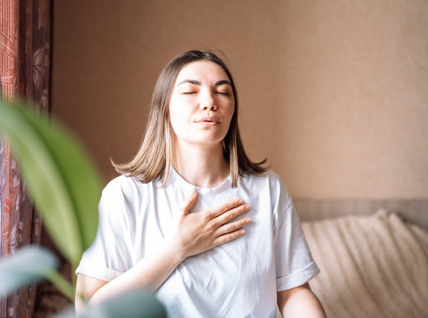 woman doing deep breathing exercises