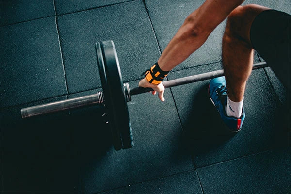 Close up of weights about to be lifted at gym