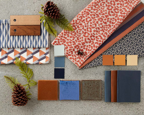 A mood board of coordinating fabrics, leathers, finishes, tiles, and paint colors