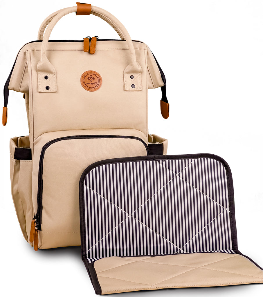 The Lenappy diaper bag in champagne color with its matching changing mat.