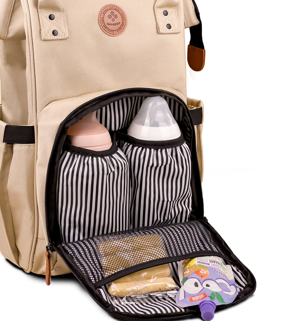 Interior of the front pocket of the Lenappy diaper bag in champagne color.