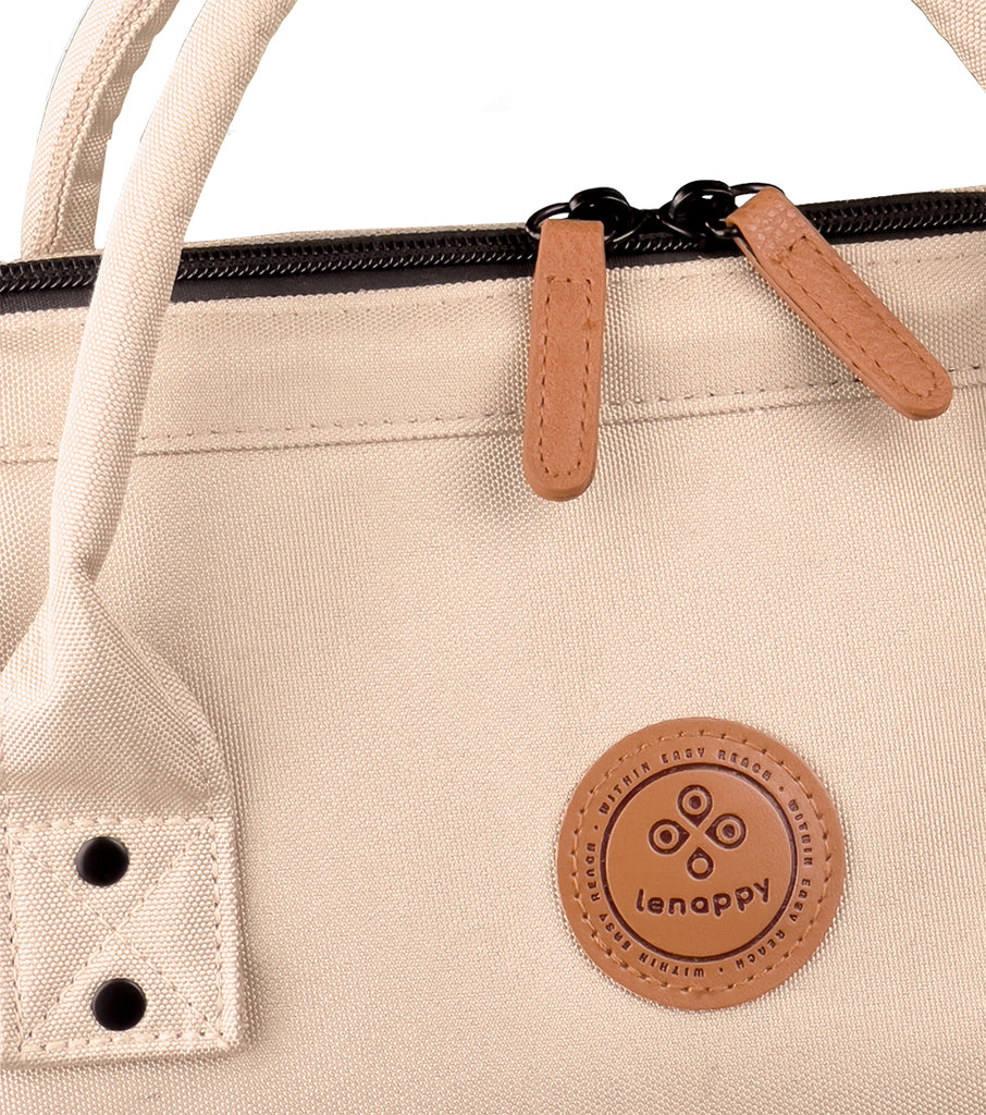 A closer look at the champagne-colored fabric of the Lenappy diaper bag