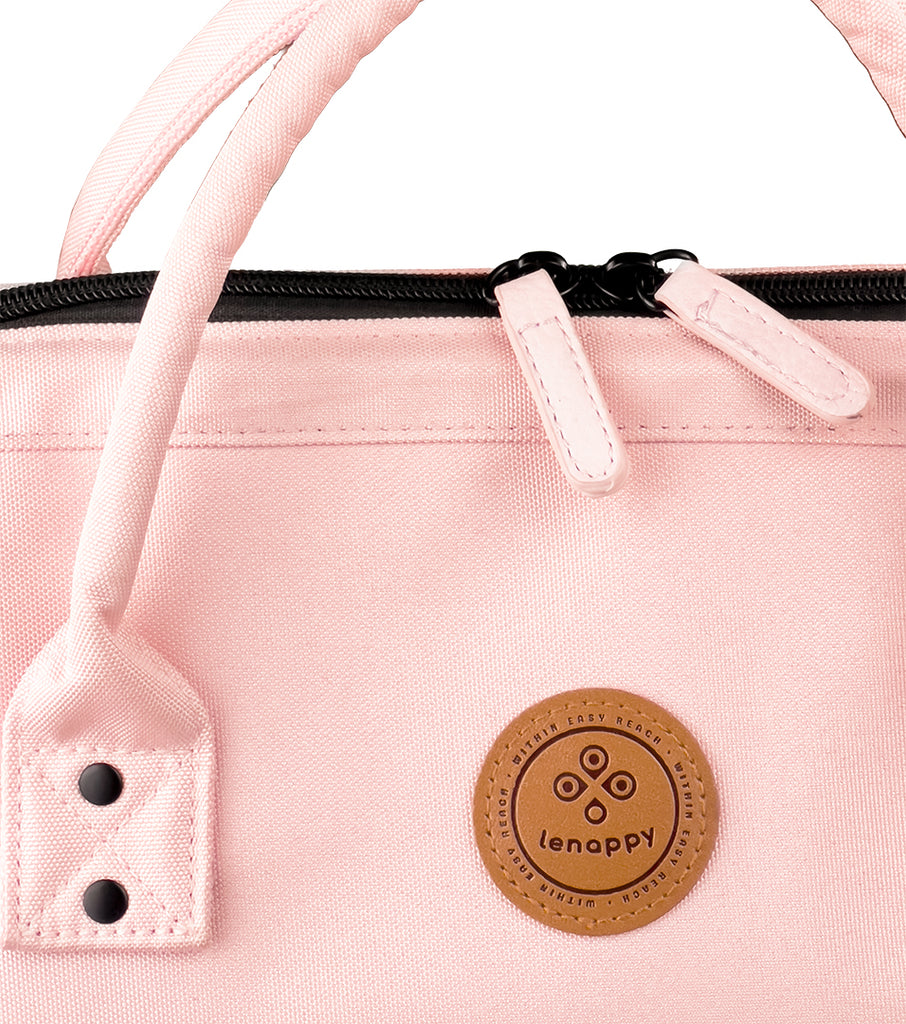 A closer look at the Nude Pink-colored fabric of the Lenappy diaper bag