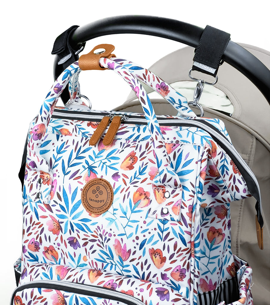 Lenappy diaper bag in Amapola color hanging on a Yoyo stroller using the provided stroller hooks
