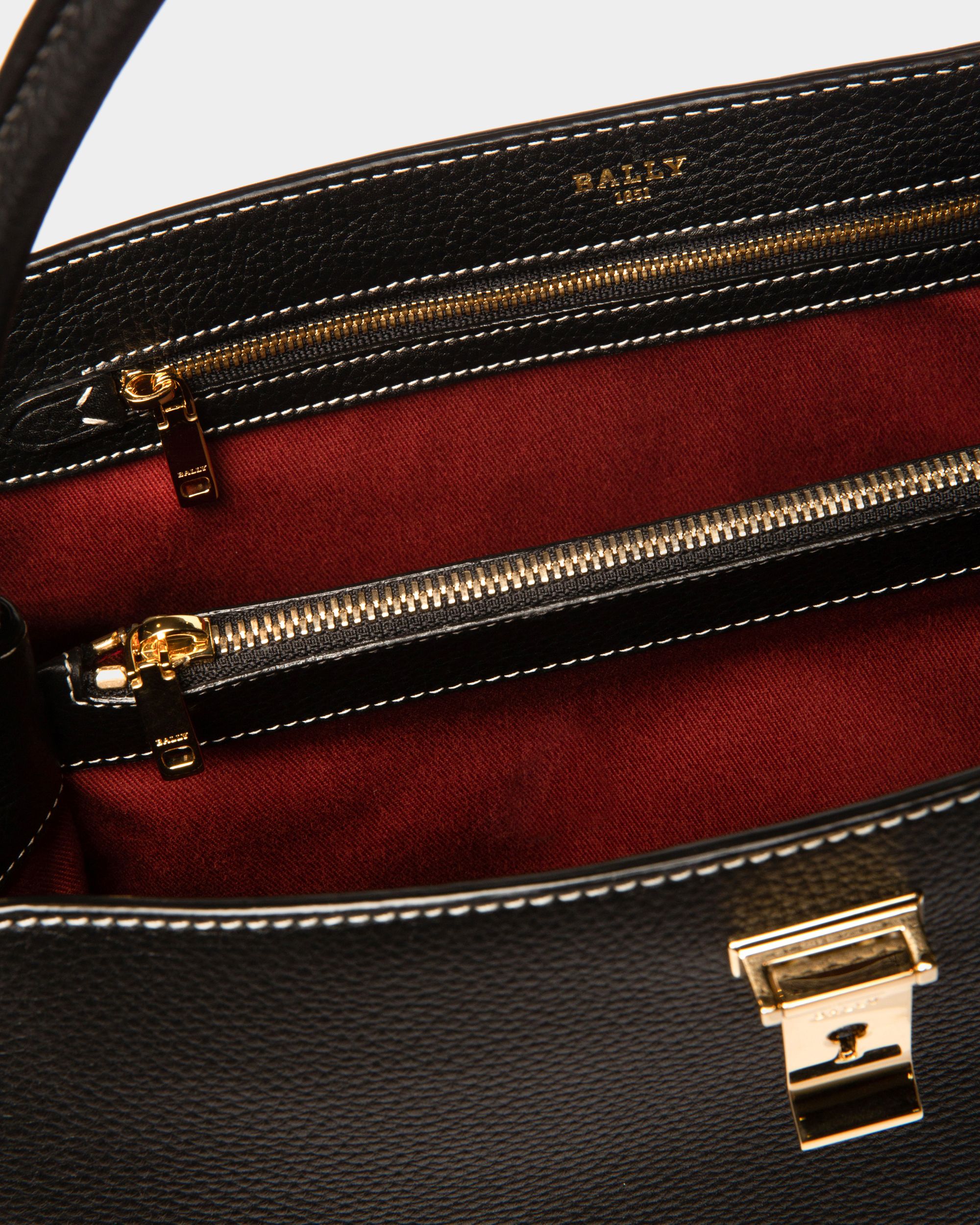 Layka | Women's Top Handle Bag | Black Leather | Bally | Still Life Open / Inside