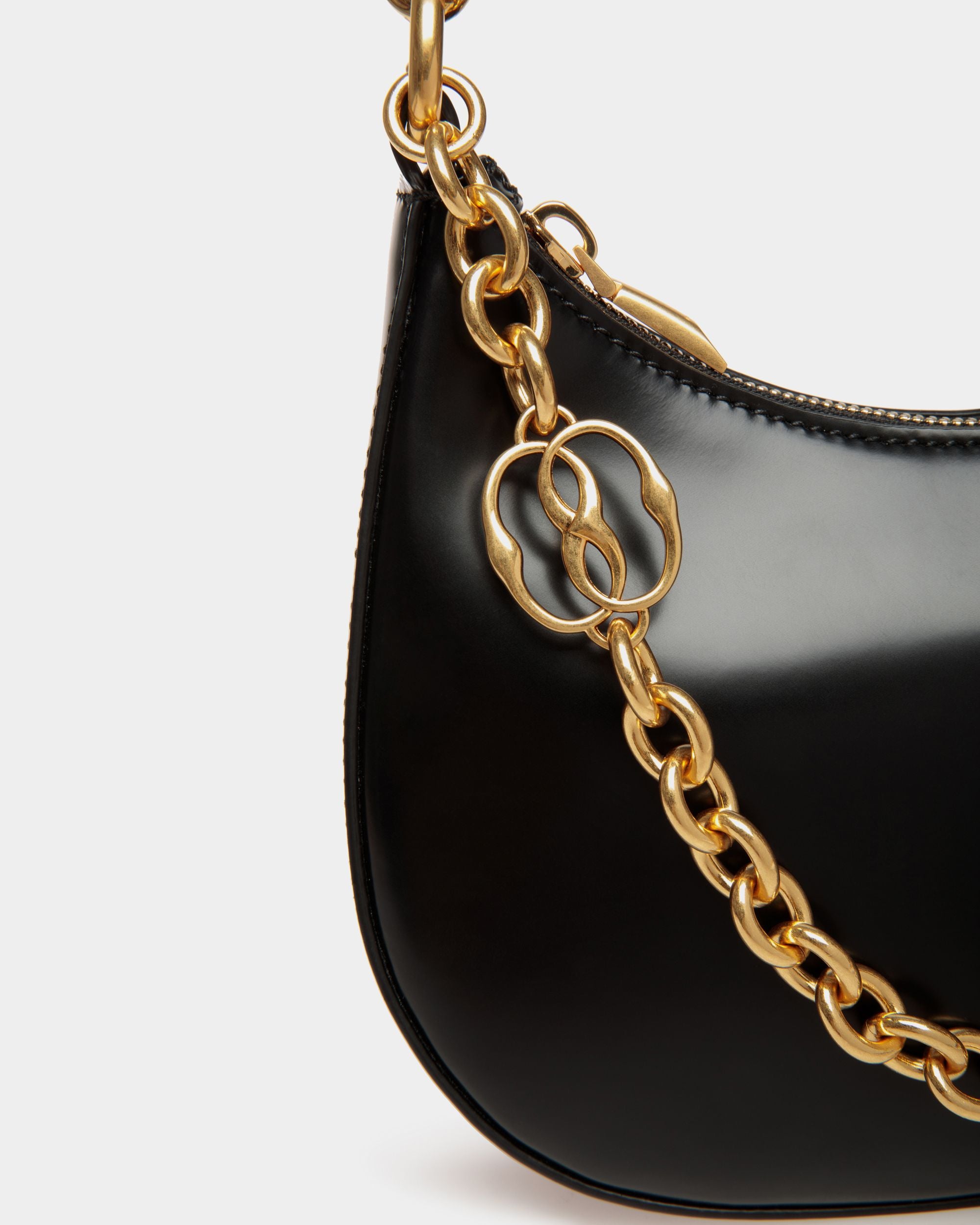 Emblem | Women's Mini Crossbody Bag in Black Brushed Leather | Bally | Still Life Detail