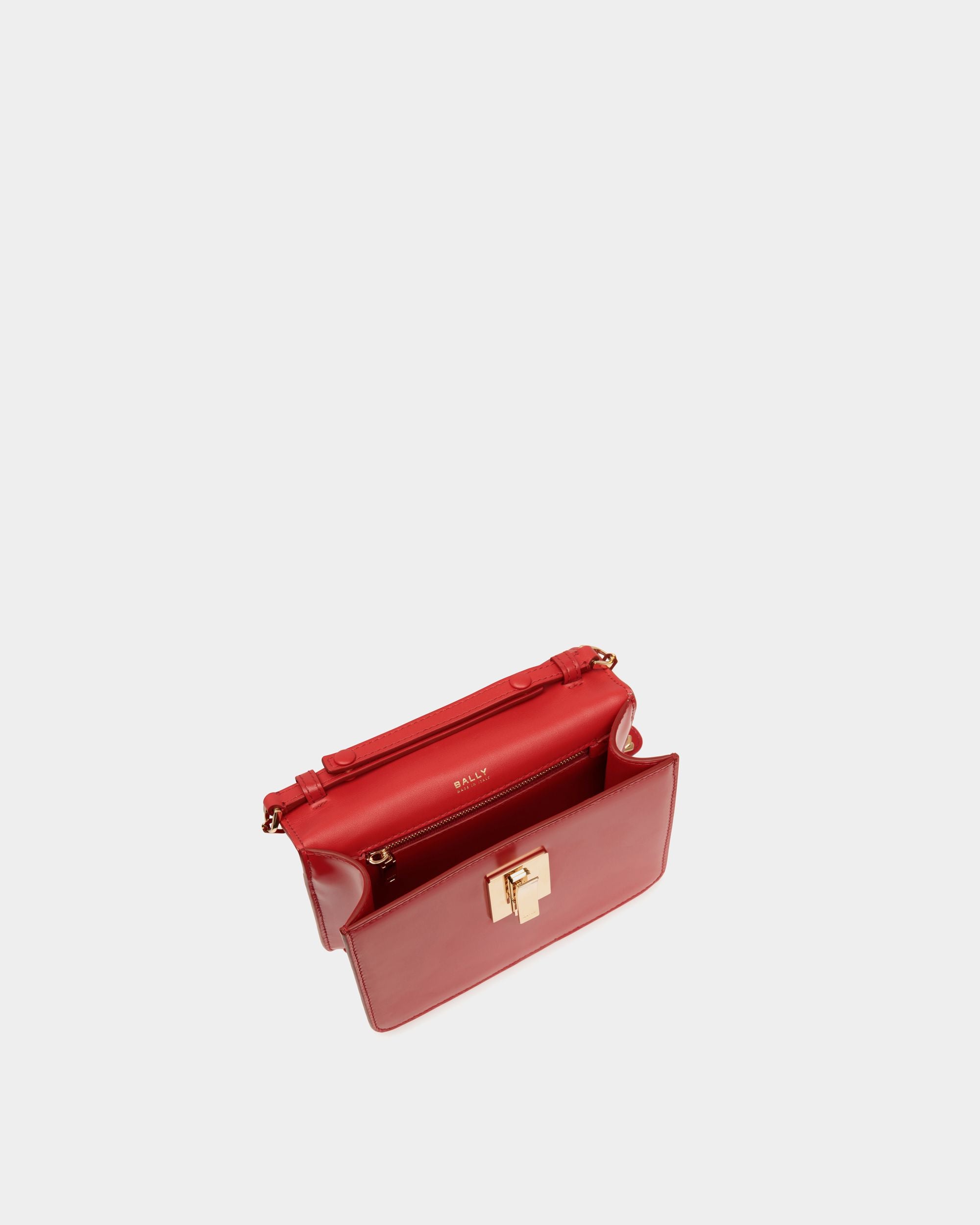 Women's Ollam Mini Top Handle Bag in Candy Red Brushed Leather | Bally | Still Life Open / Inside