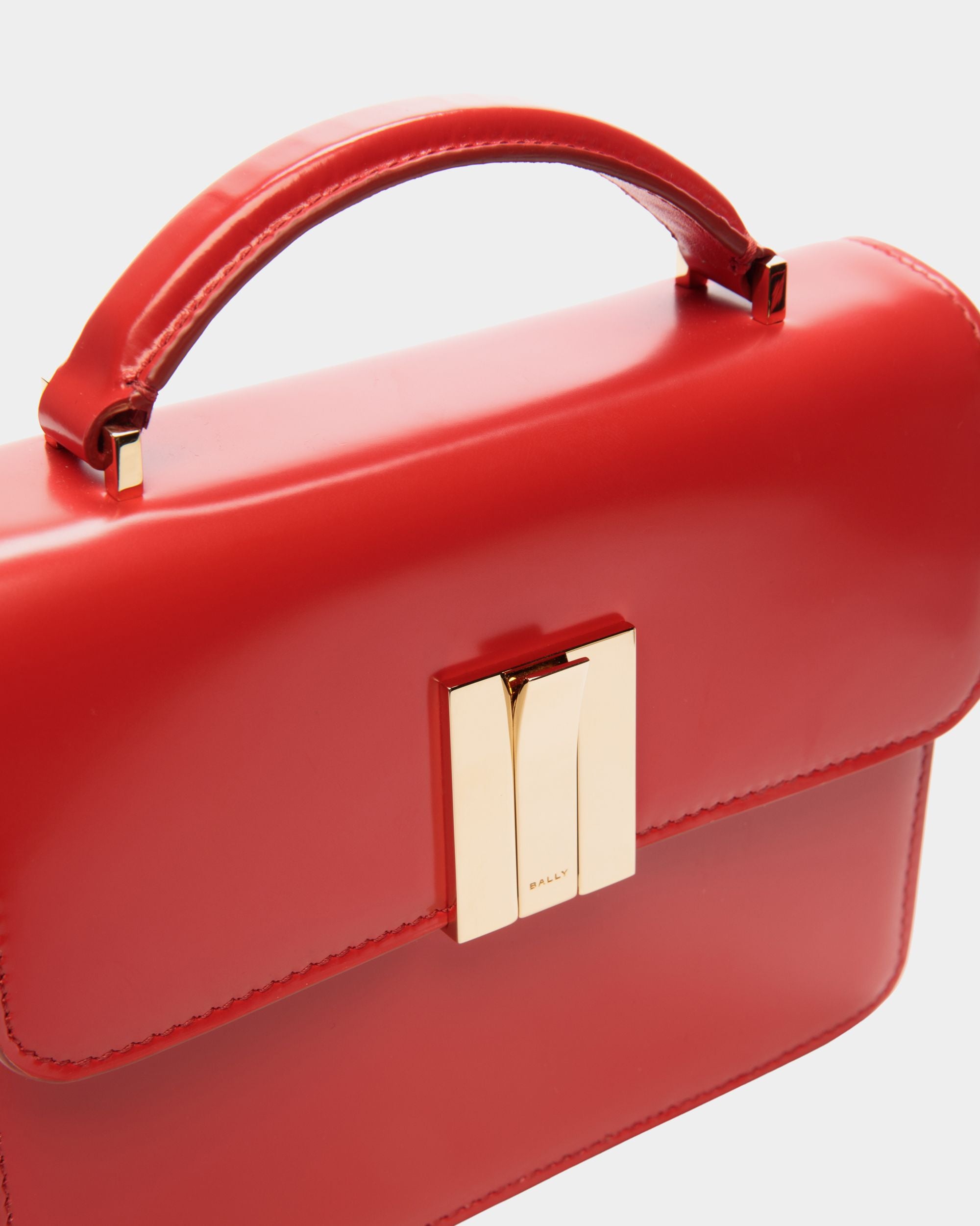 Women's Ollam Mini Top Handle Bag in Candy Red Brushed Leather | Bally | Still Life Detail