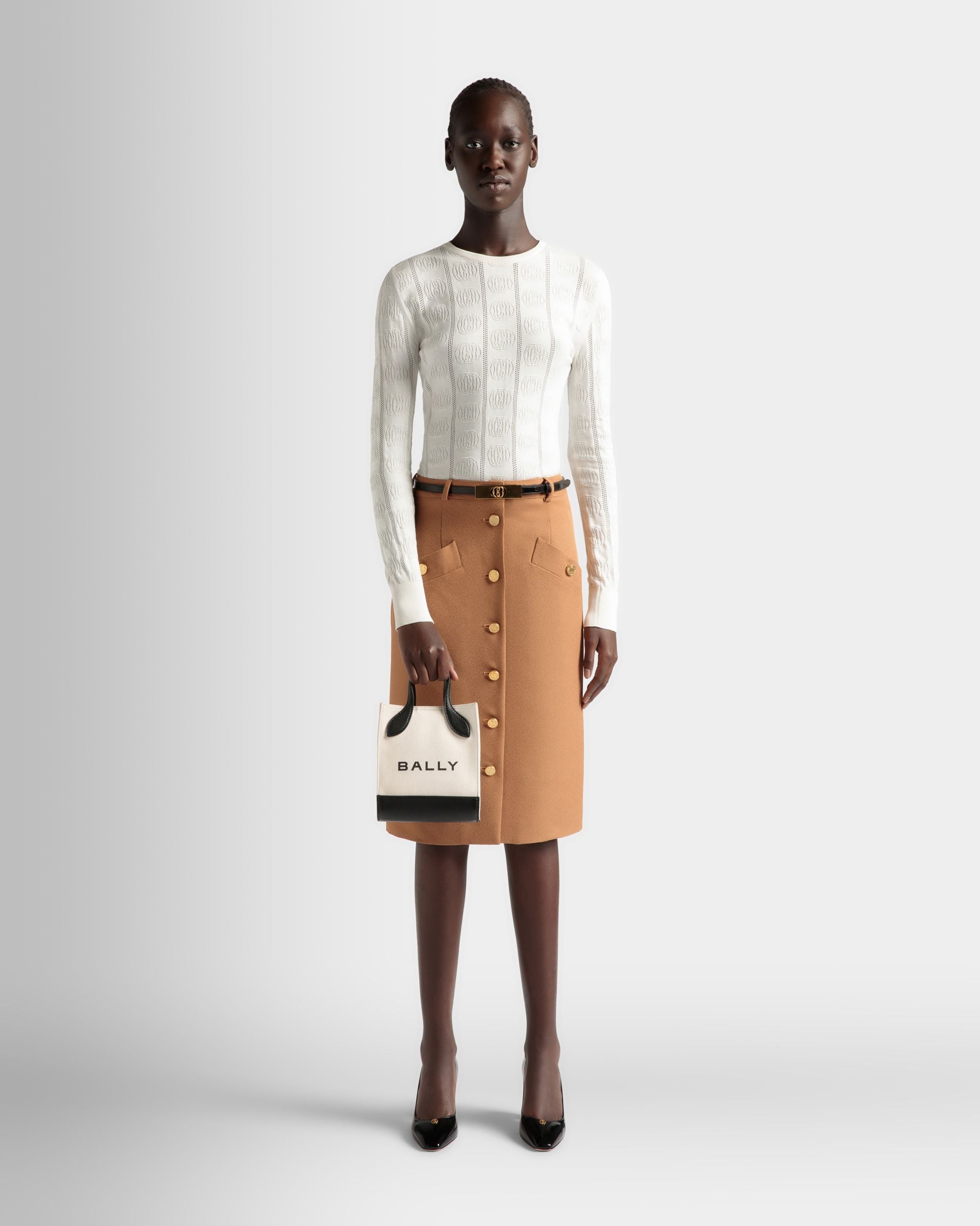 Bar | Women's Mini Tote Bag in Neutral And Black Canvas And Leather | Bally | On Model Front