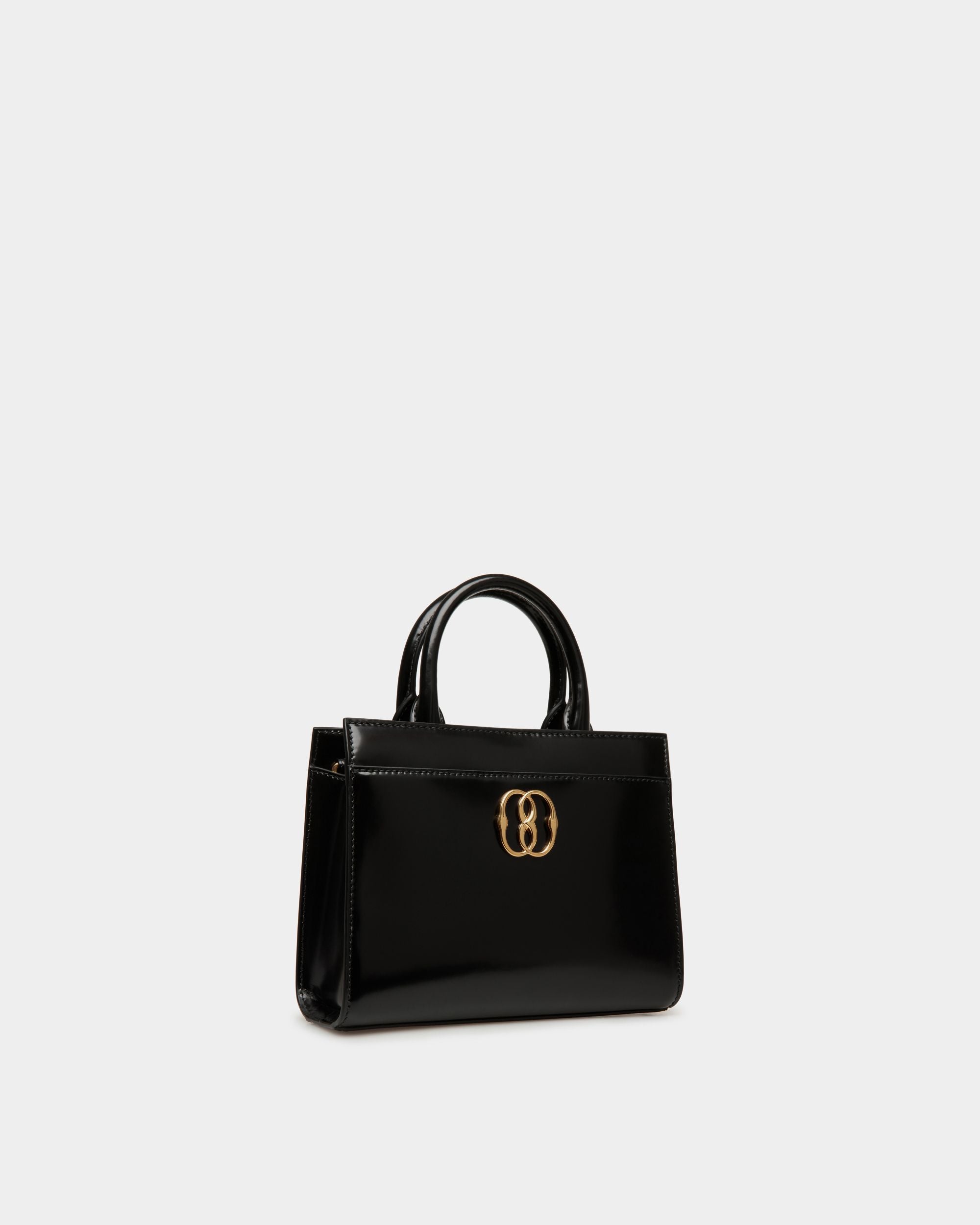 Emblem | Women's Small Tote Bag in Black Brushed Leather | Bally | Still Life 3/4 Front