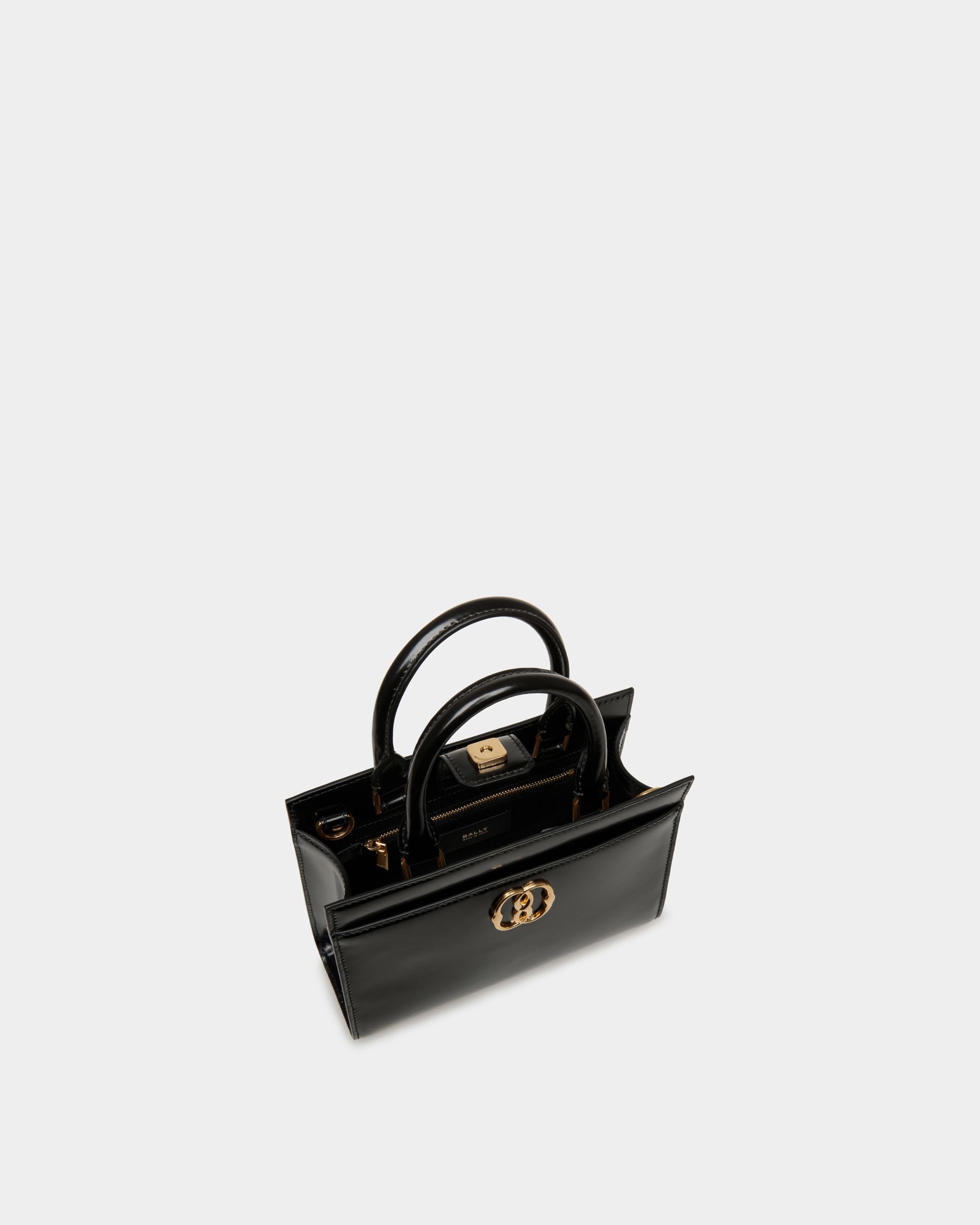 Emblem | Women's Small Tote Bag in Black Brushed Leather | Bally | Still Life Open / Inside