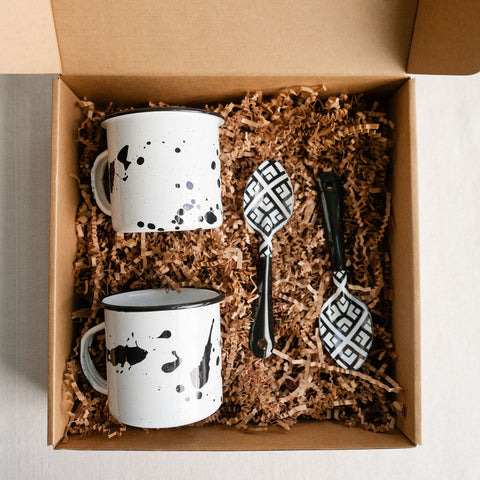 Enamel Cup and Spoon Gift Box. This set of two cups and spoons are an homage to the past, with a modern touch. The unique designs are hand drawn by a duo of sisters in Mexico City and inspired by the art of Michoacán, Mexico. The perfect housewarming gift or for those that appreciate modern Mexican, one-of-a-kind home goods.