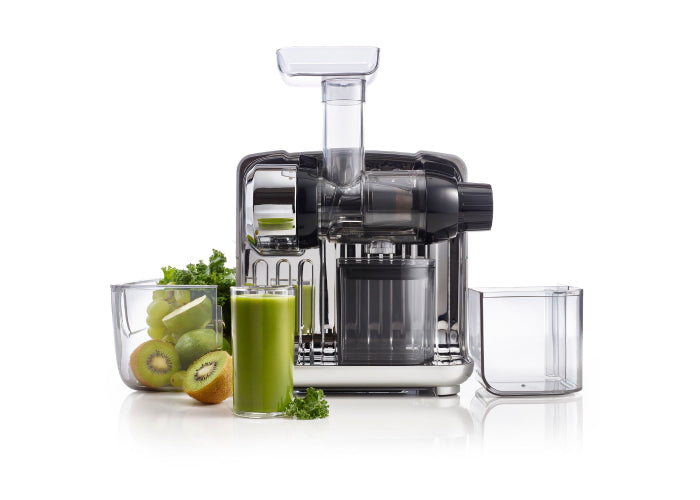 omega juicer cube with green juice