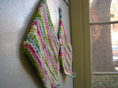 Knittedhome peppermint dishcloths on a refrigerator