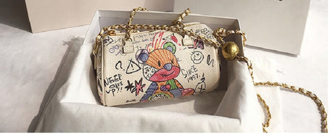 bear graffiti bag with a chain strap