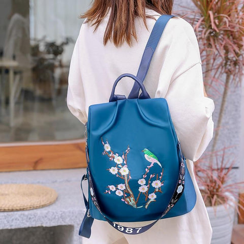 blue embroidered backpack for women on sale