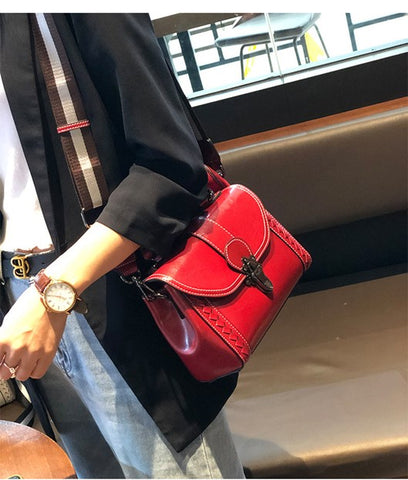 red leather handbag on sale