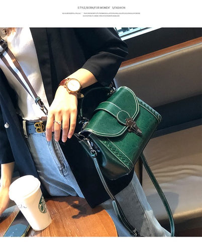 green leather handbag on sale