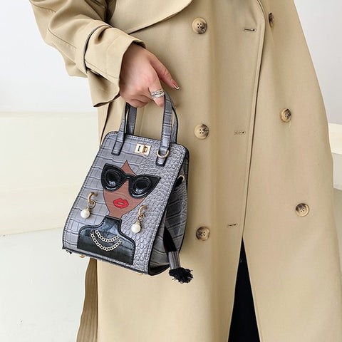 woman hand carries unique purses, novelty purses, unique handbag, novelty bags, quirky handbag