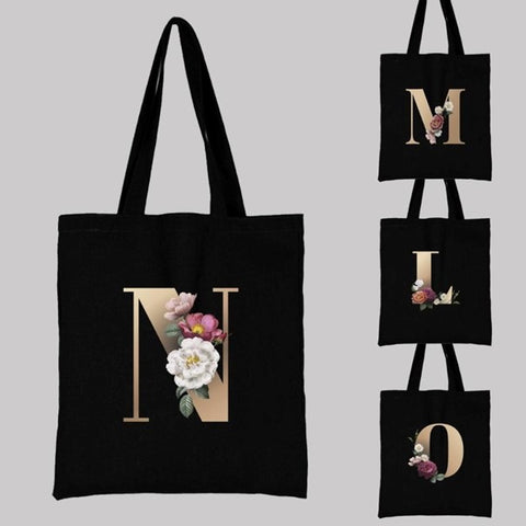 alphabet tote bag with gold initial and flower design