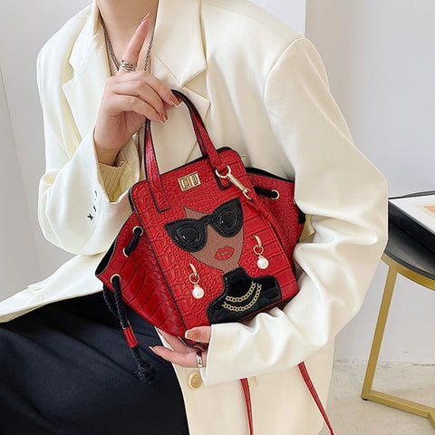 woman hand carries red unique purses, novelty purses, unique handbag, novelty bags, quirky handbag