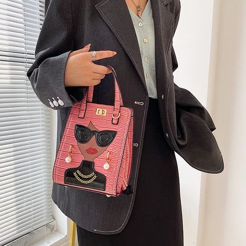 woman hand carries pink unique purses, novelty purses, unique handbag, novelty bags, quirky handbag