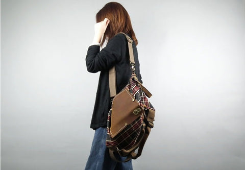 model carrying plaid messenger bag over the shoulder