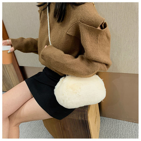 White Faux Fur Cross body Bag Against Darker Clothes