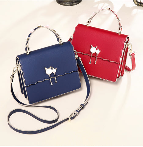 Red and blue studded crossbody bag