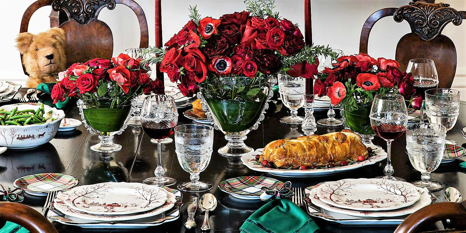 A beautiful table setting with an arrangement of flowers in Harriet Fan vases.