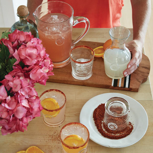 orange juice and water in pitcher on plate, Stock image